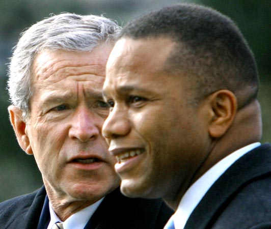George Bush speaks with Claude Allen at the White House in 2005.