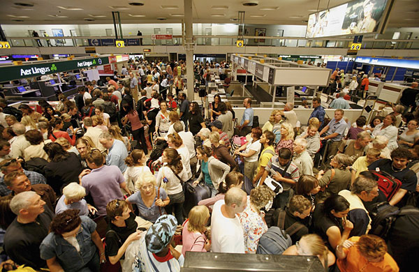 Passengers wait at Heathrow Airport.
