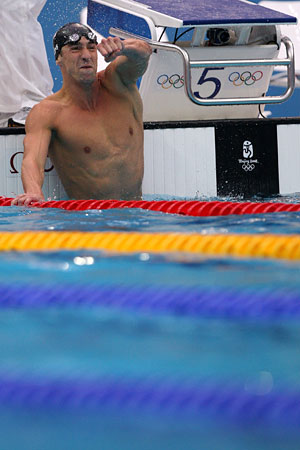 Michael Phelps celebrates his victory in the 100-meter butterfly.