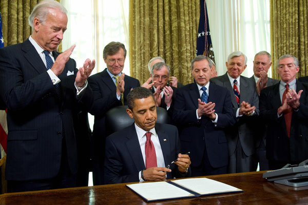 Barack Obama signs an order to close the prison at Guantanamo Bay.