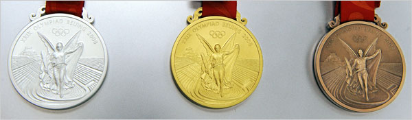 2008 Olympic medals in silver, gold, and bronze.