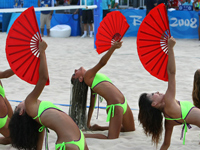 Cheerleaders perform during the women's and men's Beach Vollyball. (THOMAS COEX/AFP/Getty Images)