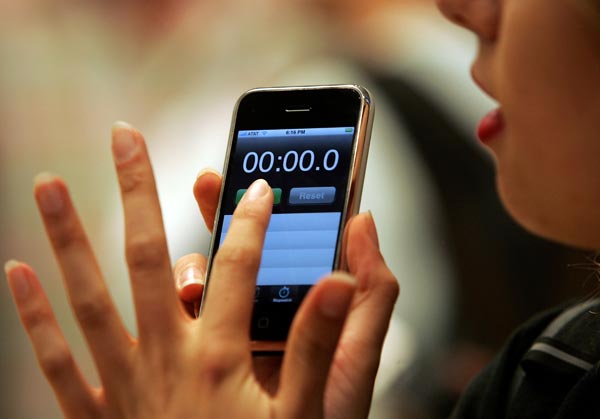 A consumer holds her new iPhone.