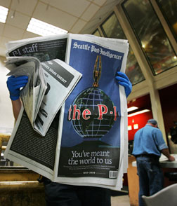 A pressman examines the Seattle Post-Intelligencer. Click image to expand.