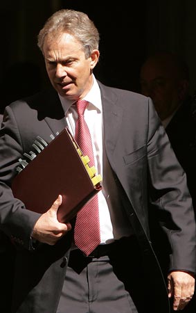 British Prime Minister Tony Blair leaves 10 Downing St. in London.