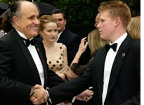 Rudolph Giuliani shakes hands with his son Andrew Giuliani at his 2003 wedding 
Click image to expand.
