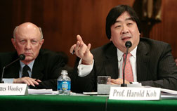 Former CIA Director James Woolsey (R), vice president of the Global Strategic Security Division of Booz Allen Hamilton; listens as Harold Hongju Koh (R). Click image to expand.