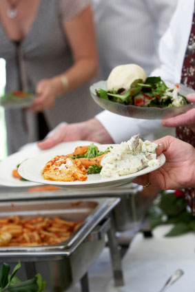 Guests at a wedding buffet.