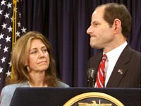 Photograph of Gov. and Mrs. Spitzer by Timothy A. Clary/AFP/Getty Images.