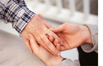 Photo of men exchanging wedding rings by Doug Menuez/Photodisc/Getty Images.