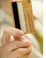 Photograph of a credit card by Medioimages/Photodisc/Getty Creative Images.
