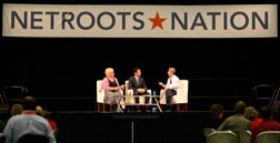 Rep. Joseph Sestak, D-Pa., right, talks with moderators Susie Madrak, left, and Ari Melber at Netroots Nation. Click image to expand.