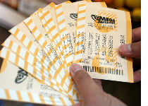 Photograph of MegaMillions tickets courtesy of Justin Sullivan/Getty Images.