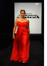 A heart disease survivor models designer Amy Sarabi’s winning garment from the Campbell’s Red Dress Challenge on 'Project Runway'.