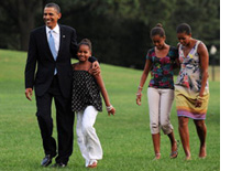 Photo of the Obamas by Olivier Douliery-Pool/Getty Images