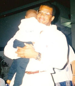 Tony Mosley picks up his adopted son Samuel in Ghana in 1998
