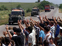Kosovar Albanians greet British troops
