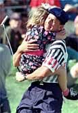 Payne Stewart hugs his daughter