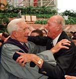 Clergyman in the clutch: the Rev. Schuller (left)