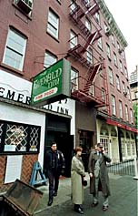 Police and reporters outside Jonathan Levin's apartment