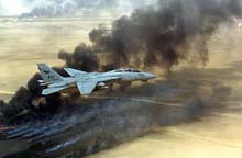 F-14 Tomcat flying over burning Kuwait oil fields