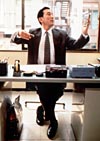 The accountant (Koji Yakusho) dances through his day at work