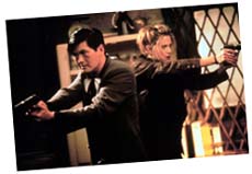 John Lee (Chow Yun-Fat) and Meg Coburn (Mira Sorvino) in The Replacement Killers