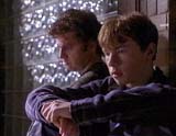 Father Ray (Anderson) and troubled teen (Brendan Fletcher)