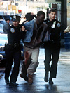 Officer Nona Valentine (Klea Scott), perp (Cyrus Farmer), and Officer Jimmy Doyle (Dylan Walsh)