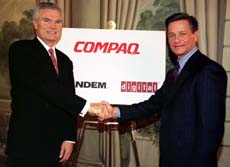 Compaq’s Eckhard Pfeiffer (L) and DEC’s Robert Palmer