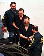Suspects William Job Leavitt Jr. (2nd from left) and Larry Wayne Harris (2nd from right)