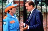 Adrian Mallone (Michael Palin) and Rollo