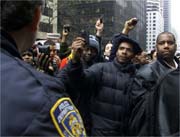 Holding up wallets in protest