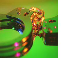 Handcuffs. Photograph by John Foxx/Stockbyte/Getty Images.