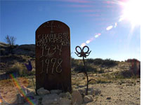 A desert sniper victim is buried where he died